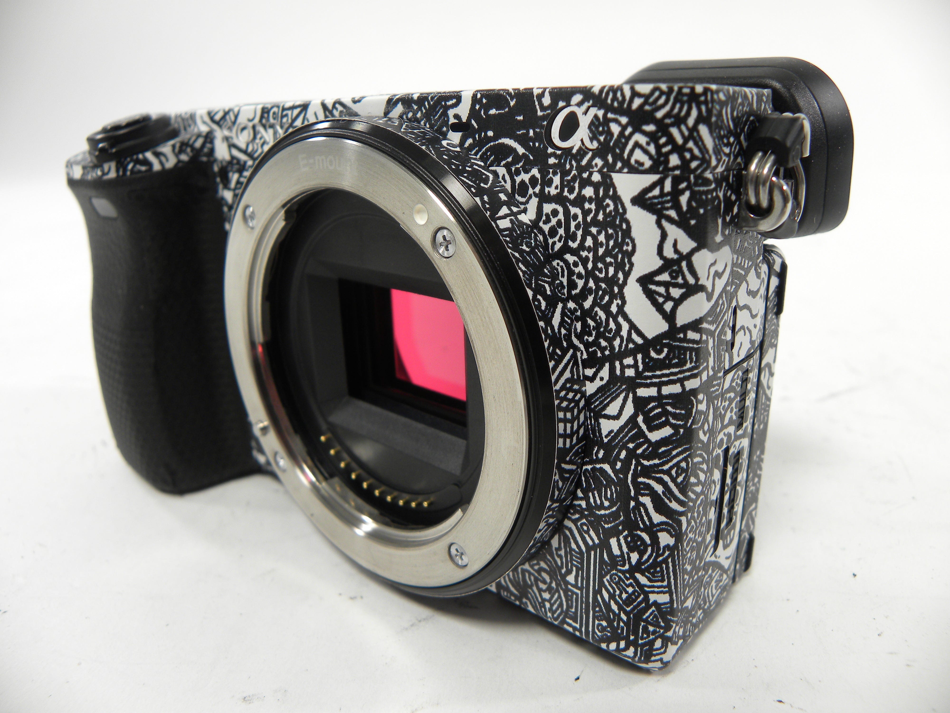 Sony a6400 24.2mp Mirrorless Digital camera Body Only  w/Skin Shutter Ct. 5,061